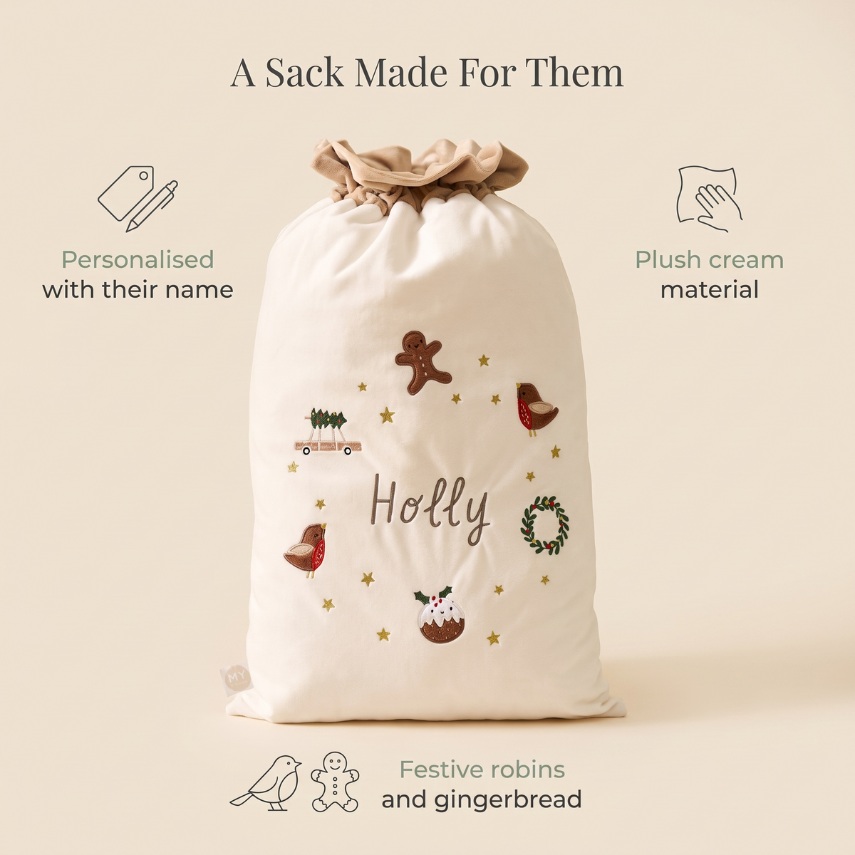 Child with a personalised cream Santa sack on Christmas morning