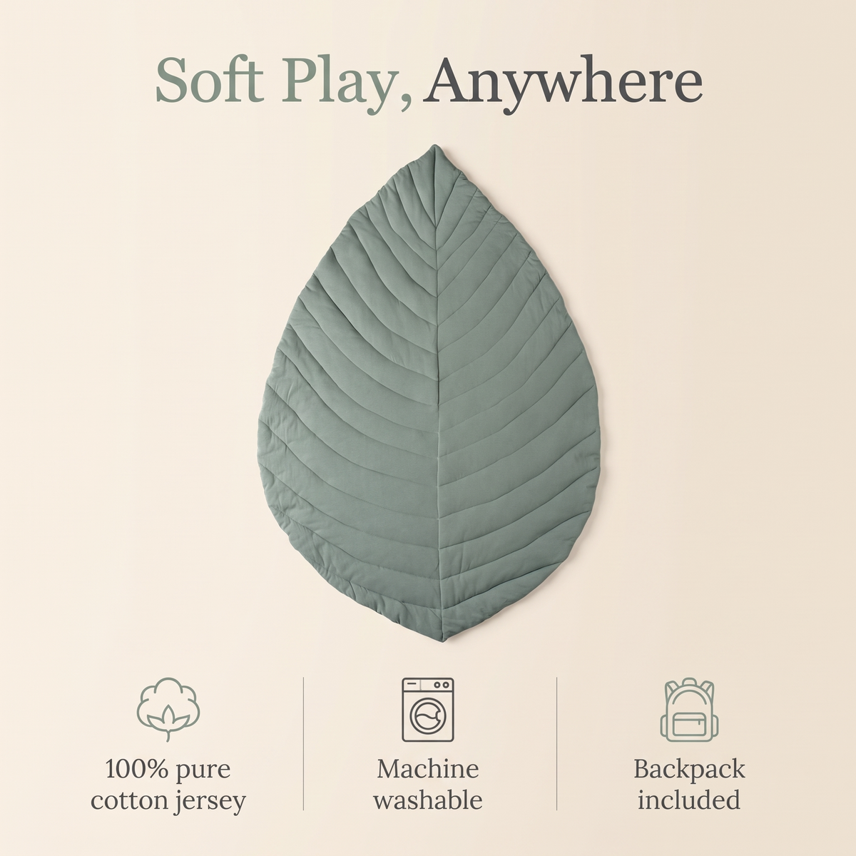 Sage green leaf cotton play mat styled in a neutral nursery