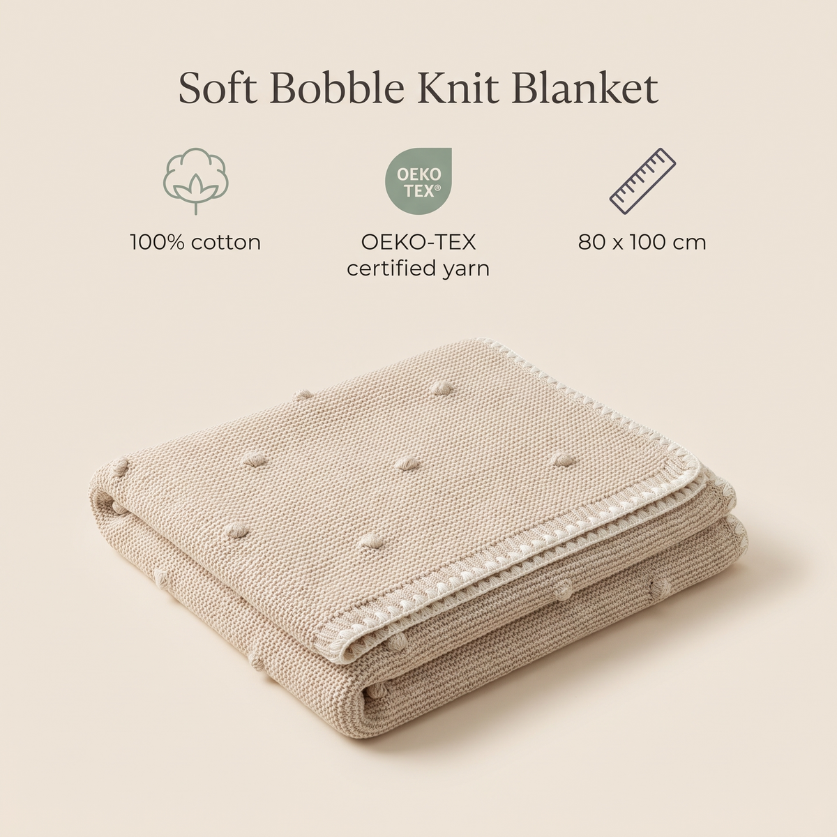 Natural cotton bobble knit baby blanket styled on a pram
