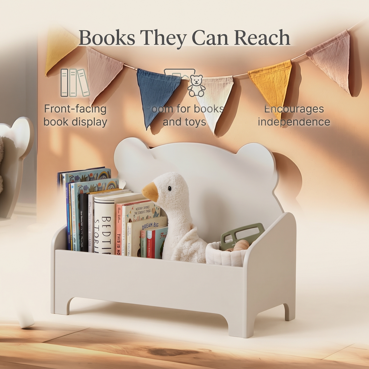 Pebble bear book storage beside a toddler bed in a bright bedroom