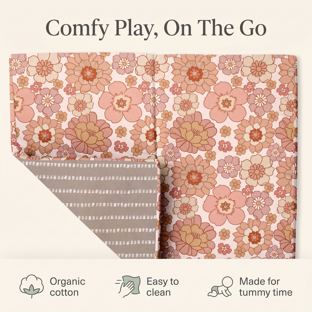 Large floral play mat styled in a soft neutral nursery
