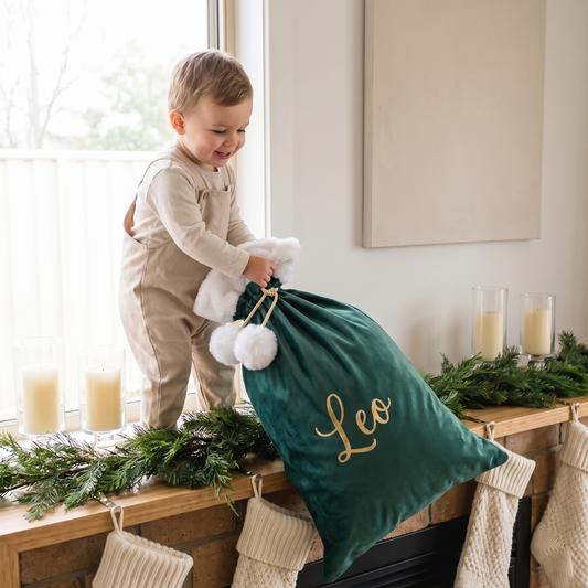 Little Teekie Personalised Pom Pom Santa Sack | Gold Vinyl Name, 50x70cm – White Trim – in use, shows scale