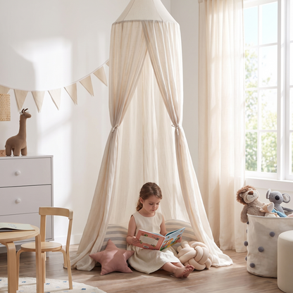 Child reading inside the hanging canopy