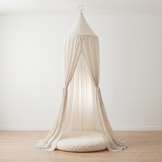 Oatmeal sheer linen-look kids bed canopy hanging in a bright bedroom
