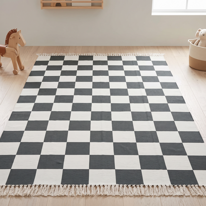 Khaki checkerboard kids rug on a pale oak floor in a bright Scandinavian kids room