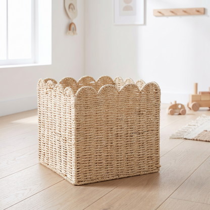 Scalloped woven cube storage basket in a bright Scandinavian kids room