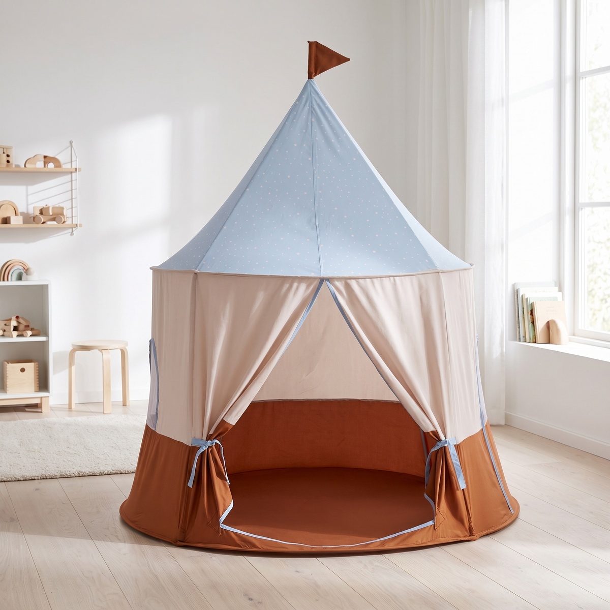 Blue circus-style kids play tent in a bright Scandinavian kids room