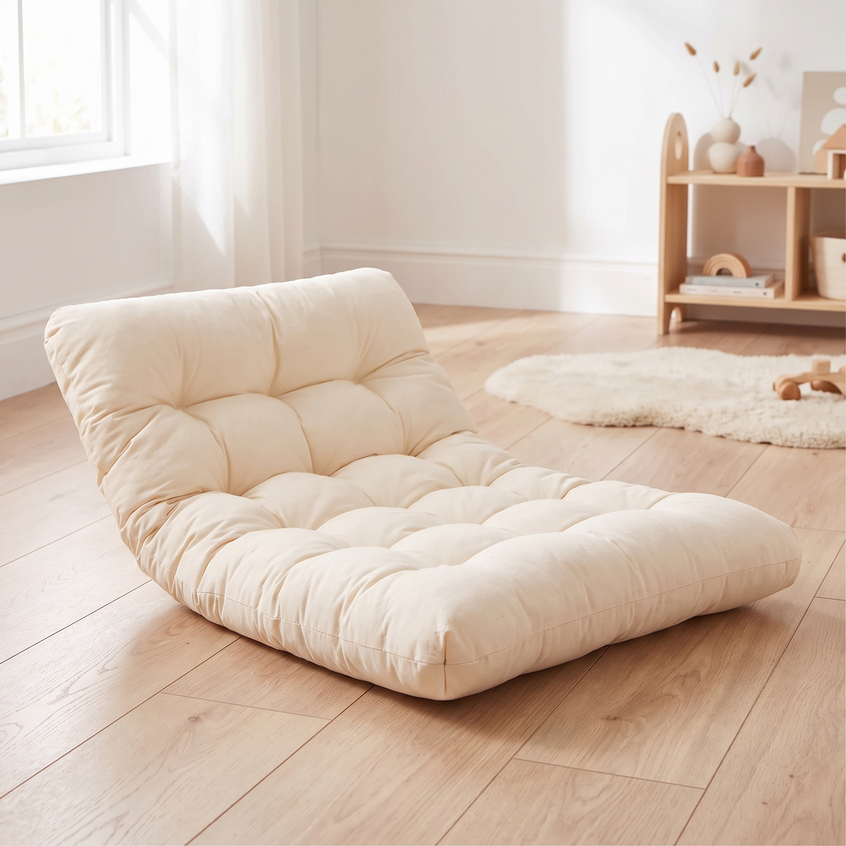 Cream thick padded cotton play cushion on an oak floor in a kids room