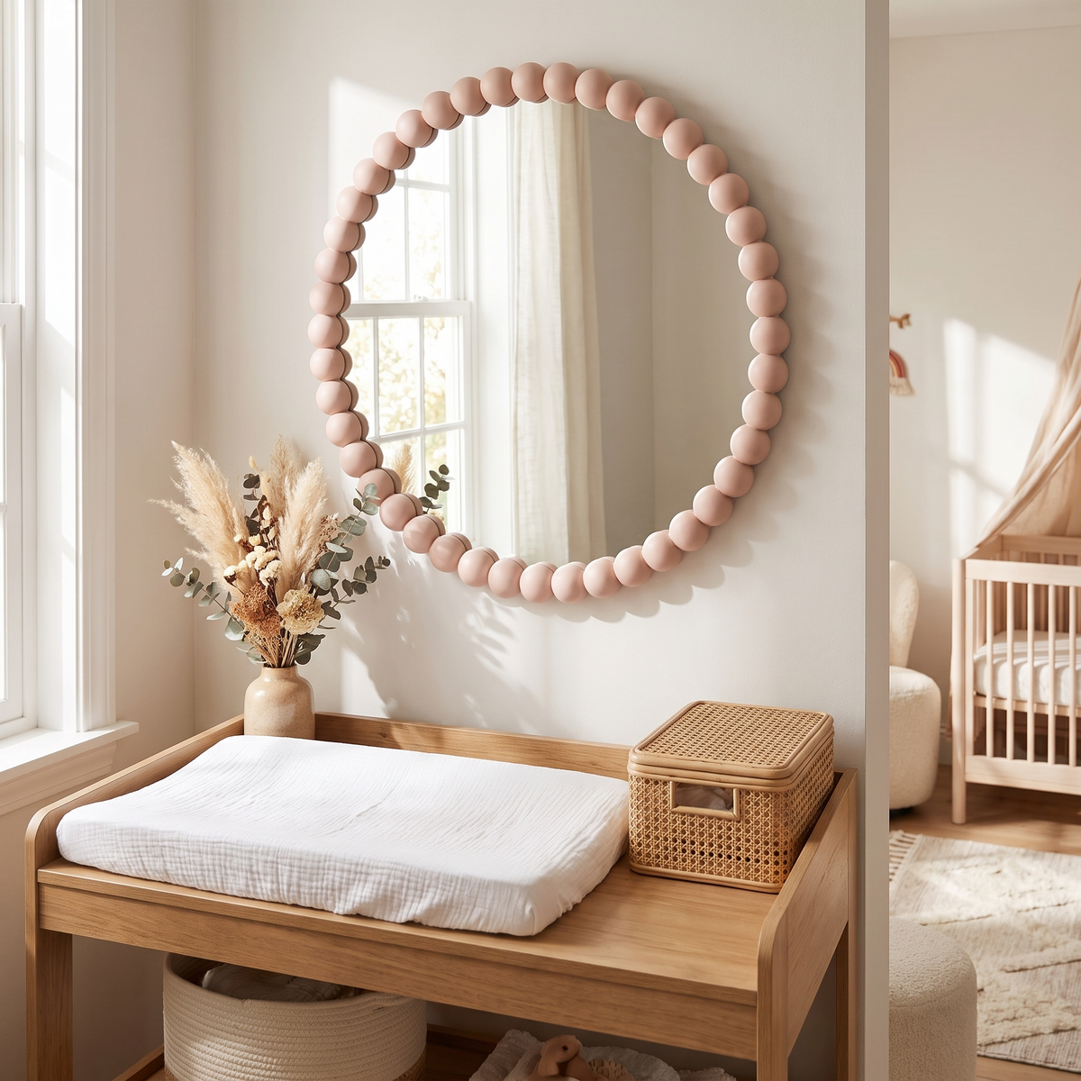 Pink bobbin mirror styled in a light-filled nursery