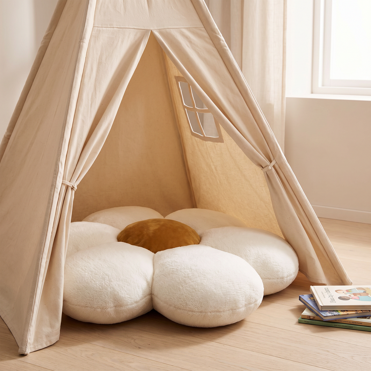 Flower floor cushion used as a cosy seat inside a kids play tent
