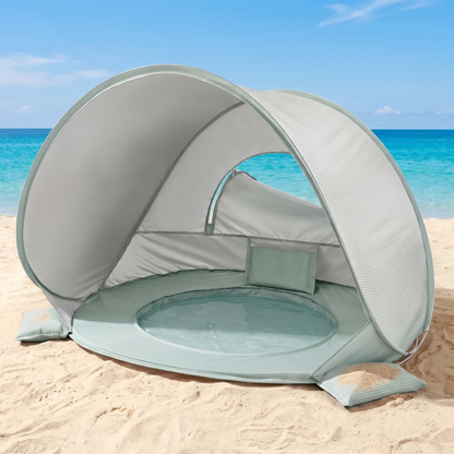 Baby beach tent anchored with sandbags on a sunny Australian beach