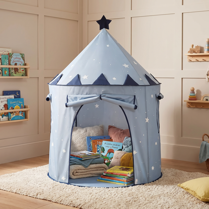 Starry kids tent styled as a reading nook with cushions and picture books