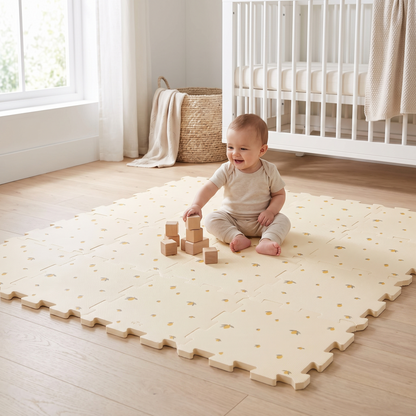 Baby playing with blocks on the foam play mat