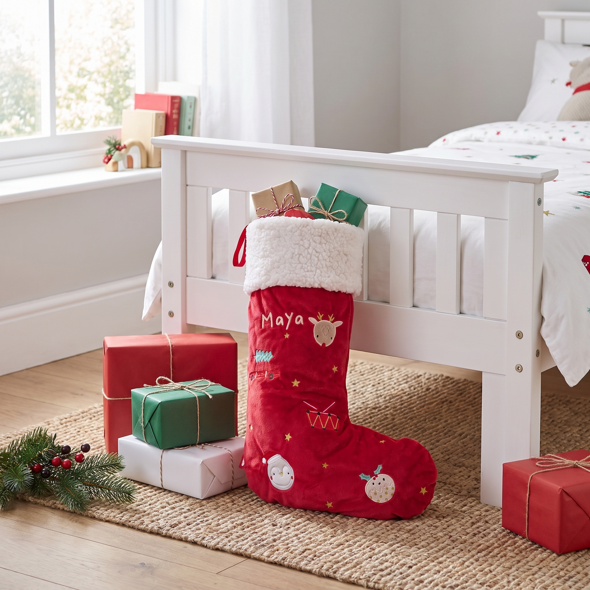 Close-up of embroidered name on red velvet Christmas stocking cuff
