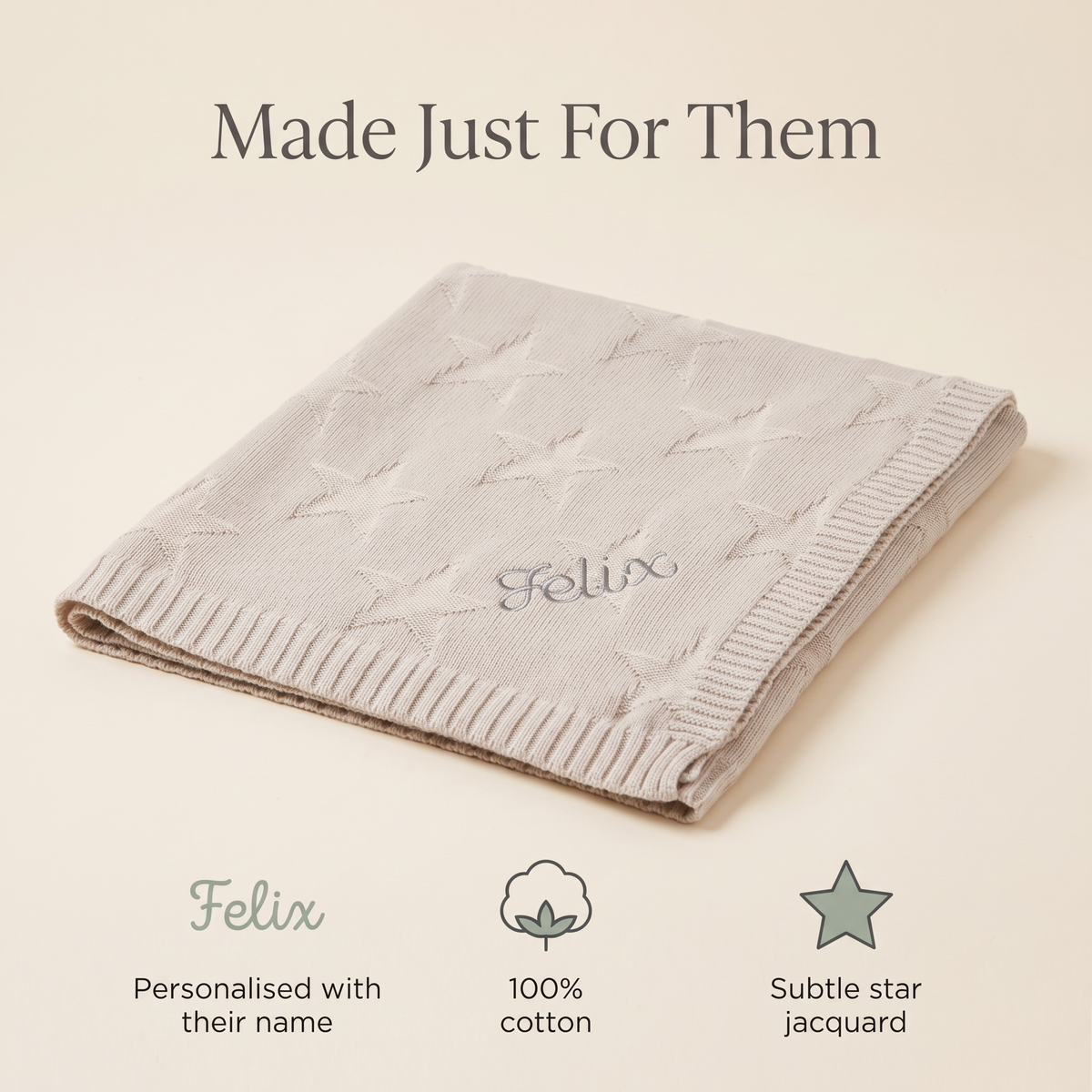 Baby wrapped in a personalised oatmeal star cotton blanket