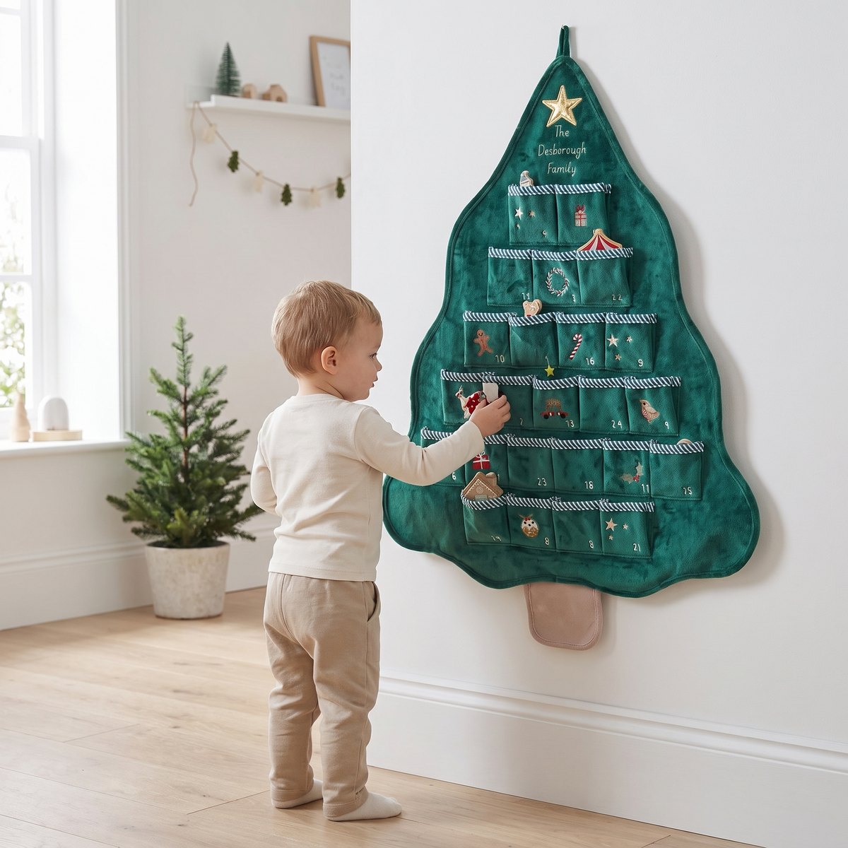 Fabric advent calendar tree hanging on a wall in a festive family room
