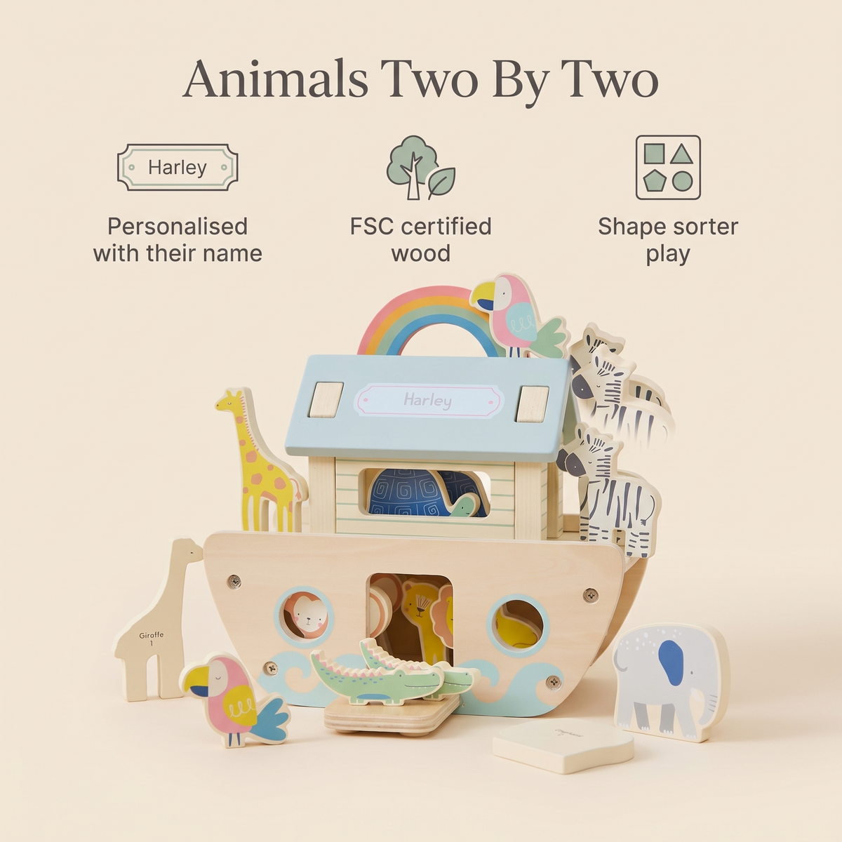 Child playing with the wooden Noah's ark animal set on a nursery floor