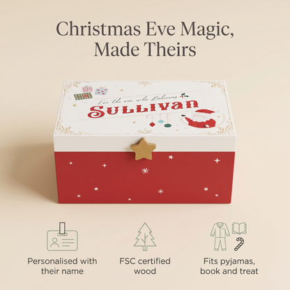 Child opening a personalised wooden Christmas Eve box