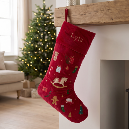 Personalised large red velvet Christmas stocking with embroidered festive motifs