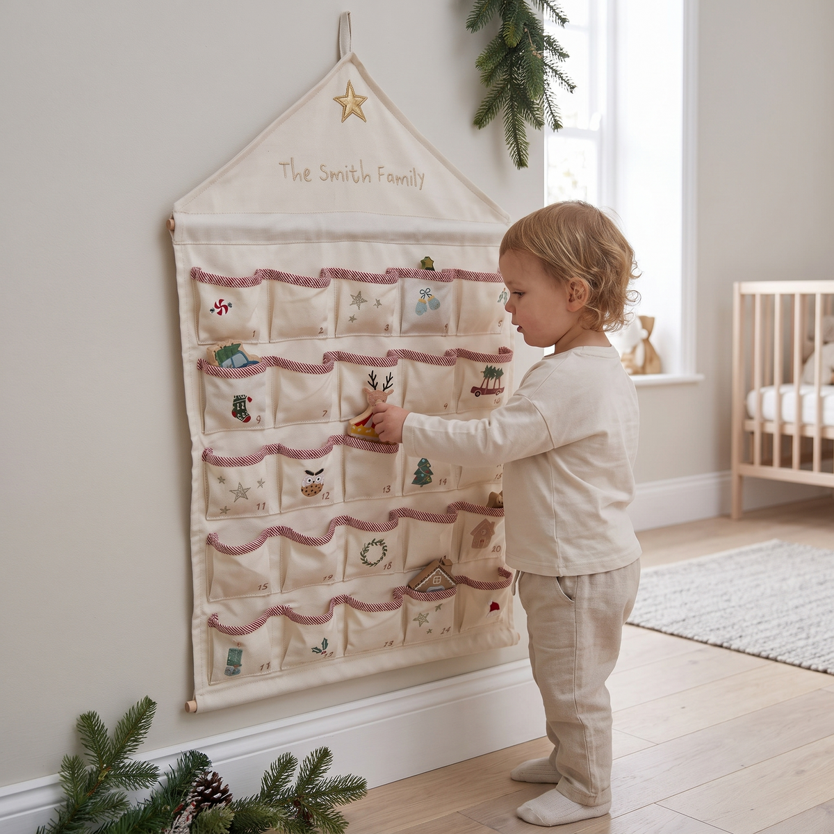 Cream woven advent calendar hanging on a wall in a neutral Christmas living room