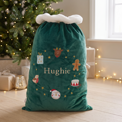 Personalised green velvet Santa sack with embroidered Christmas wreath and name