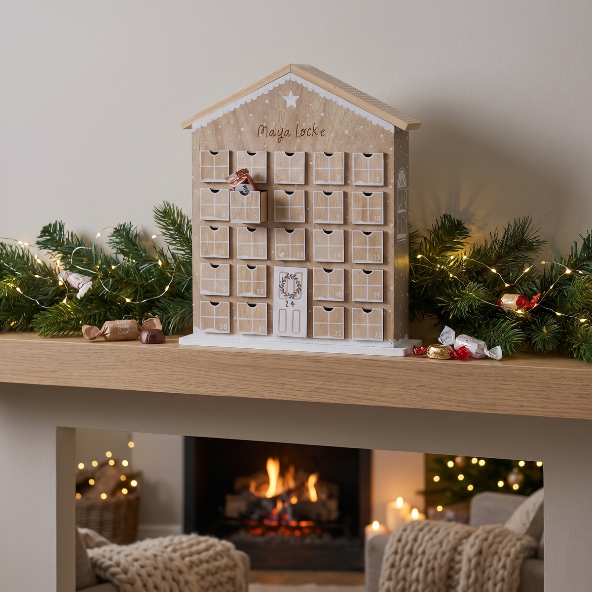 Close-up of numbered drawers on personalised gingerbread advent house