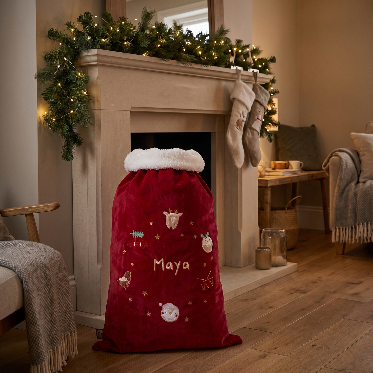 Close-up of embroidered name on red plush personalised Santa sack