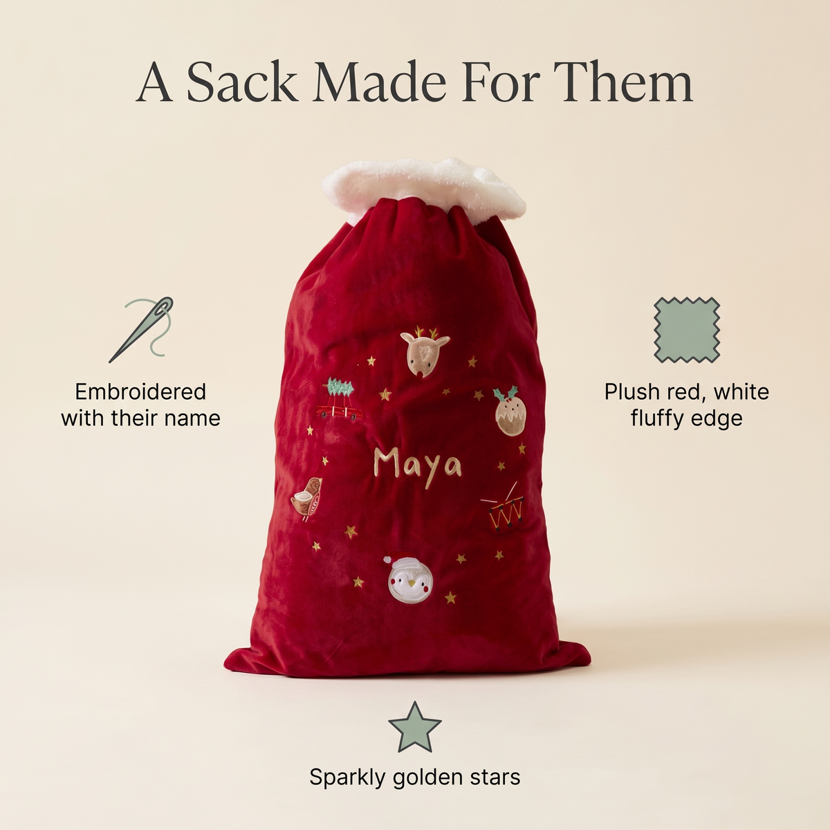 Child holding a personalised red Santa sack on Christmas morning
