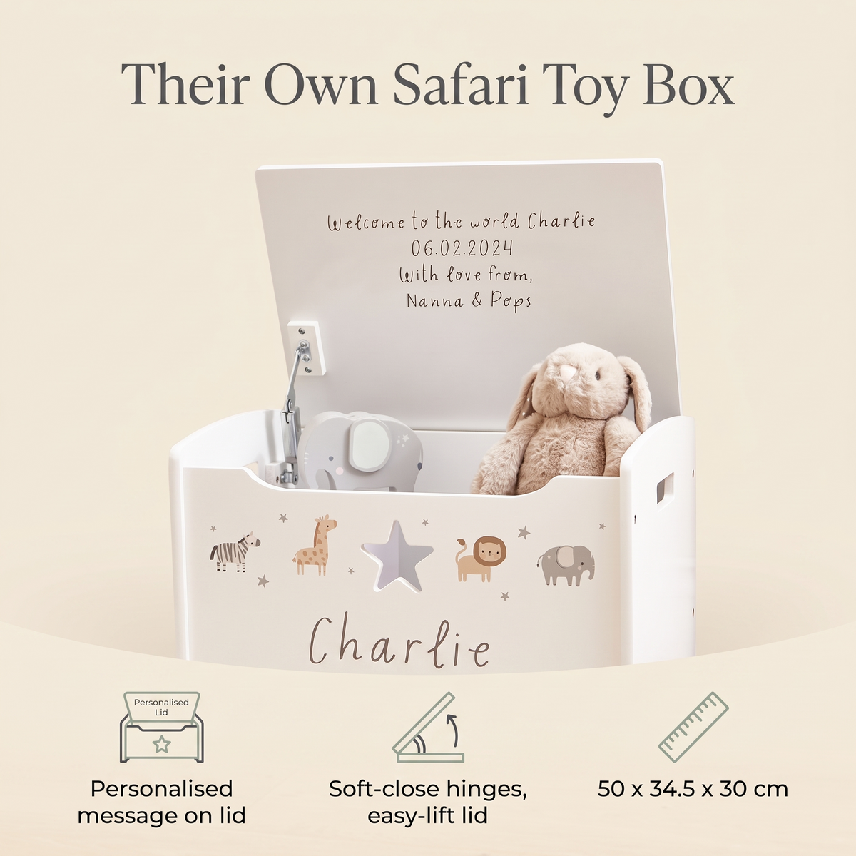 Toddler opening a personalised white wooden safari toy chest