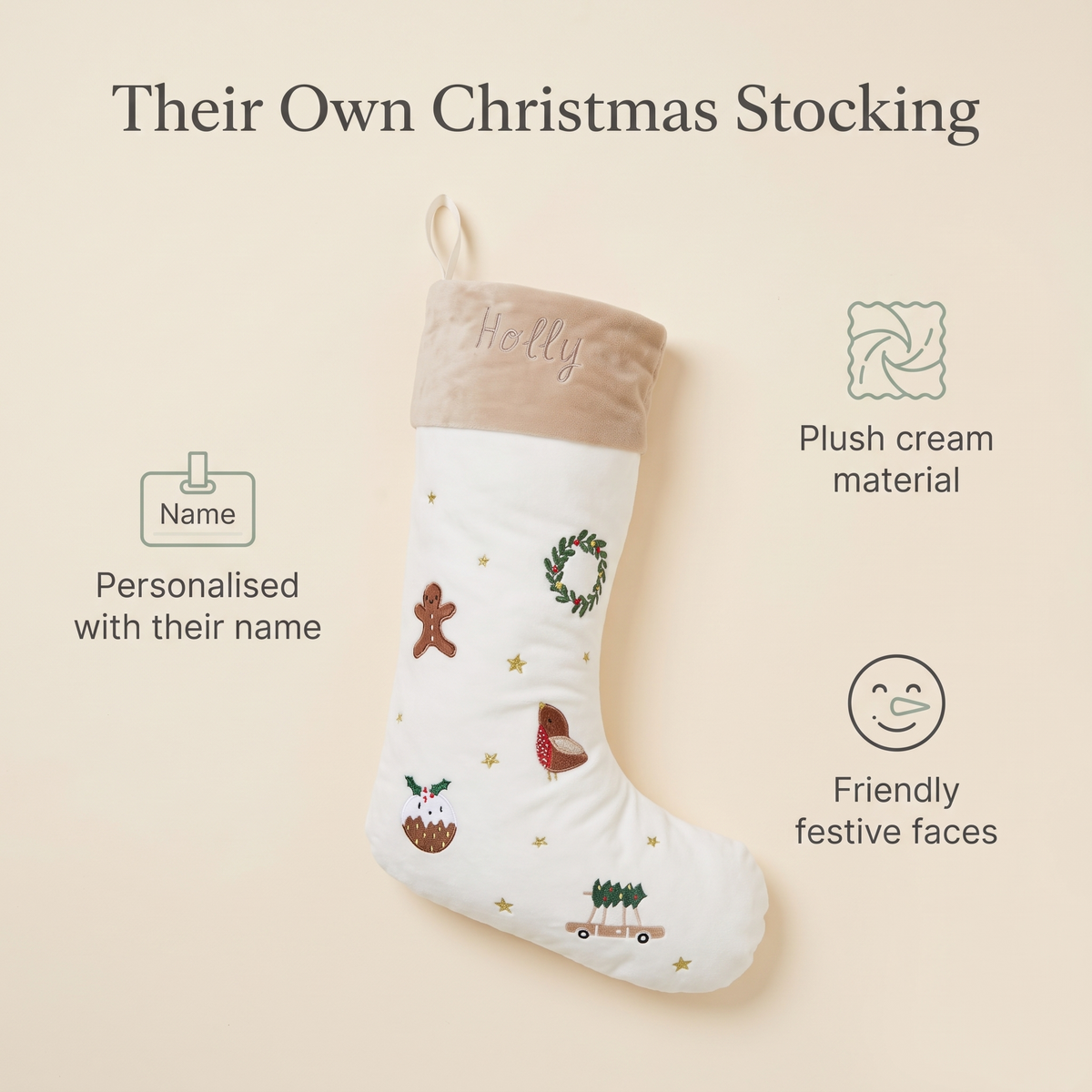 Cream personalised Christmas stocking styled in a neutral festive living room
