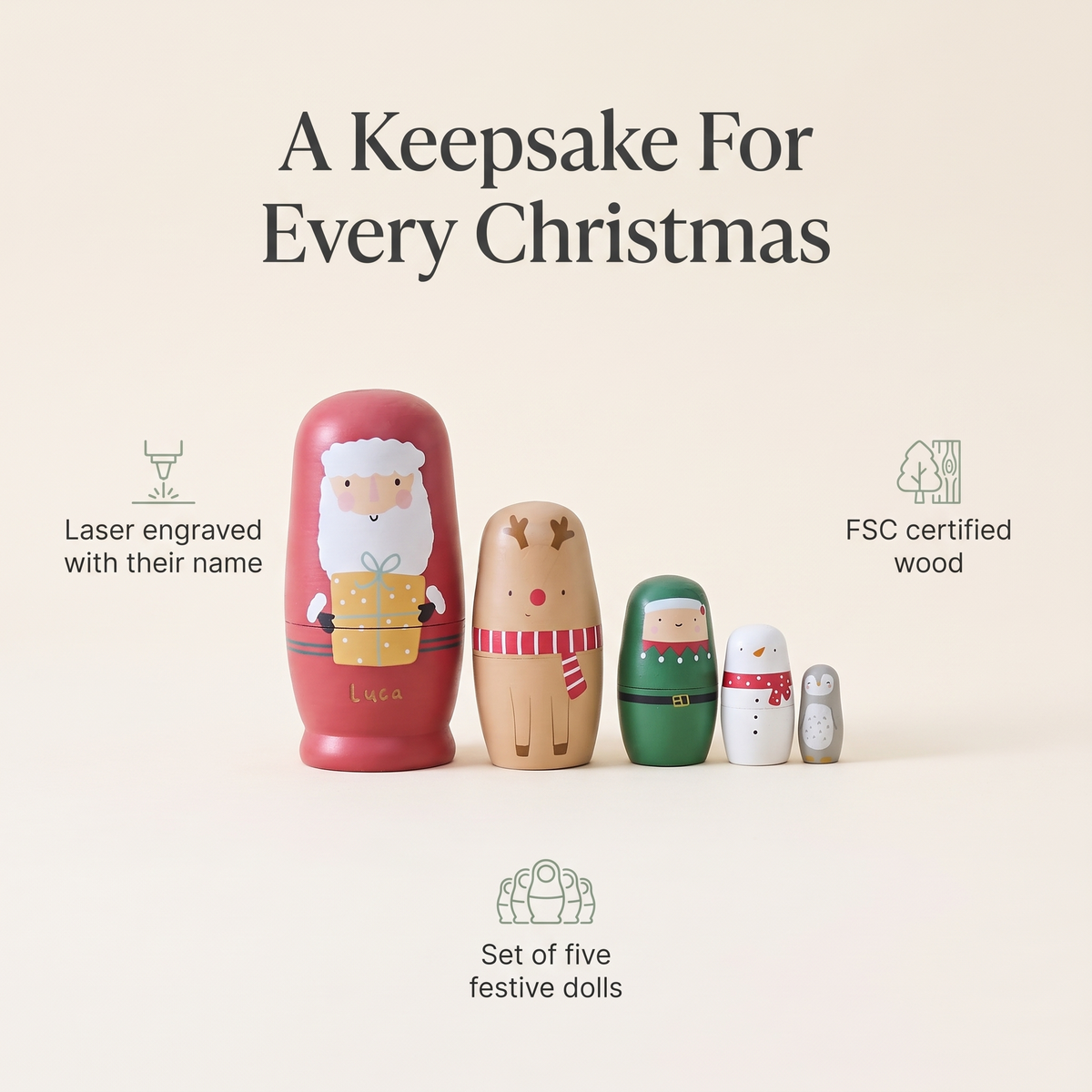 Child playing with personalised Christmas nesting dolls by the tree