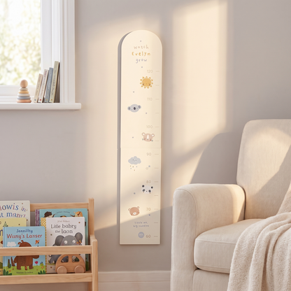 Cream animal height chart styled in a neutral Scandi-style children's room