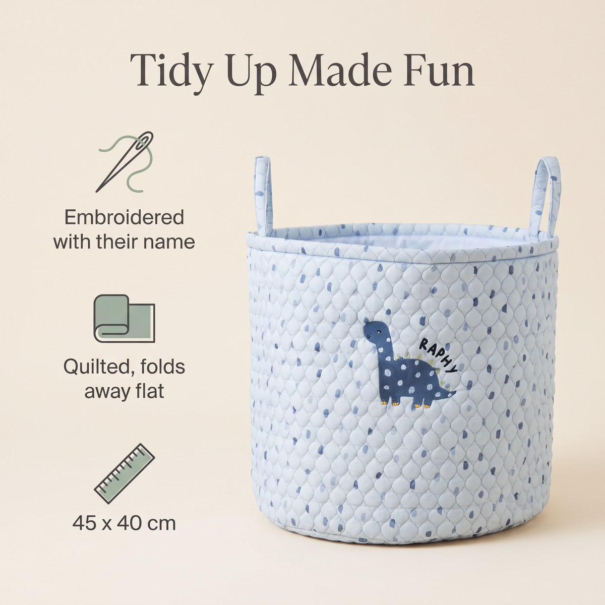 Child carrying a personalised blue dinosaur storage bag by its handles