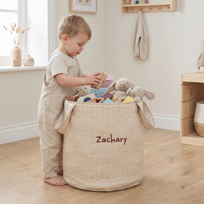 Close-up of personalisation and ticking stripe lining on neutral nursery storage bag