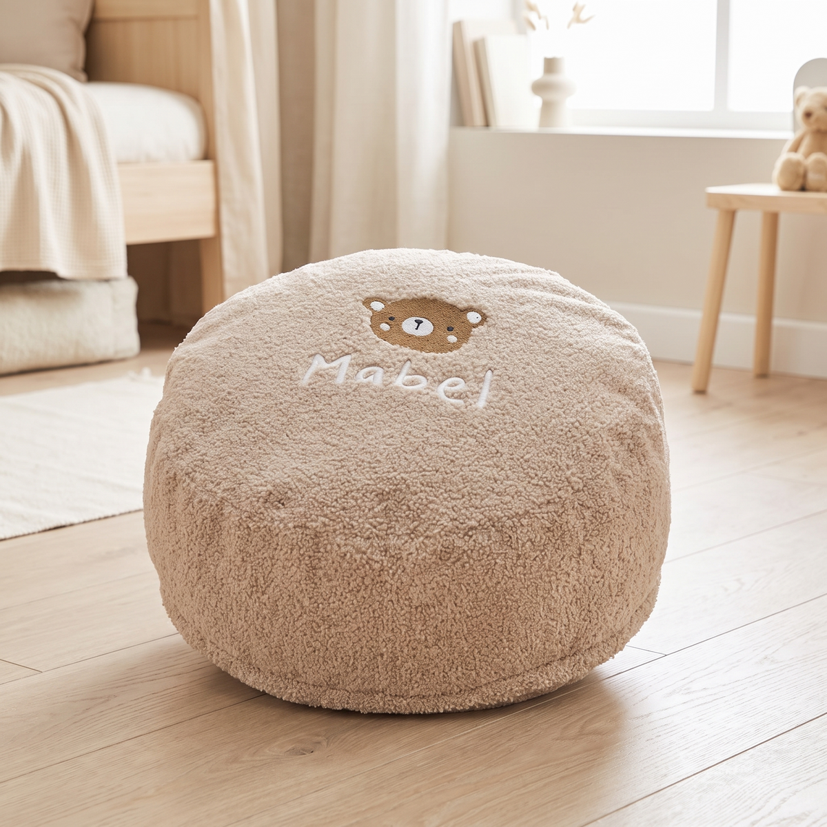 Personalised caramel bear bean bag foot stool with embroidered name in a nursery
