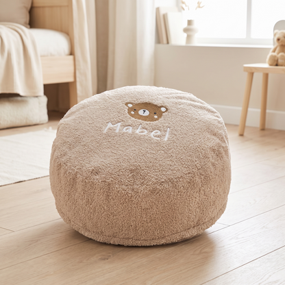 Personalised caramel bear bean bag foot stool with embroidered name in a nursery
