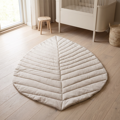 Oat leaf-shaped cotton baby play mat on a nursery floor