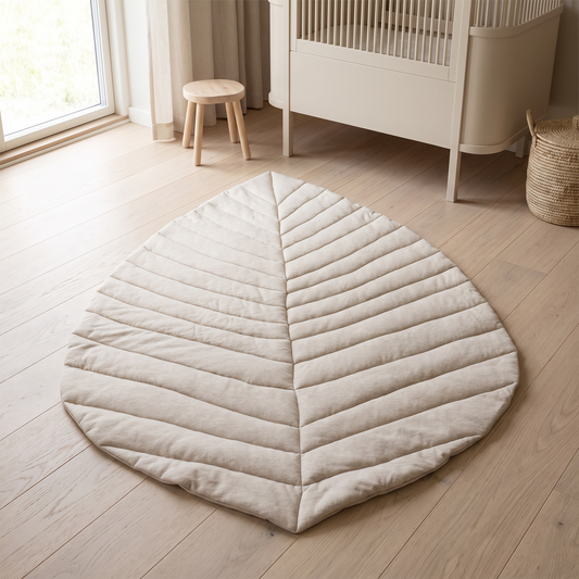 Oat leaf-shaped cotton baby play mat on a nursery floor