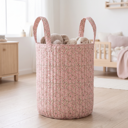 Large soft pink fairy floral storage basket filled with toys in a nursery