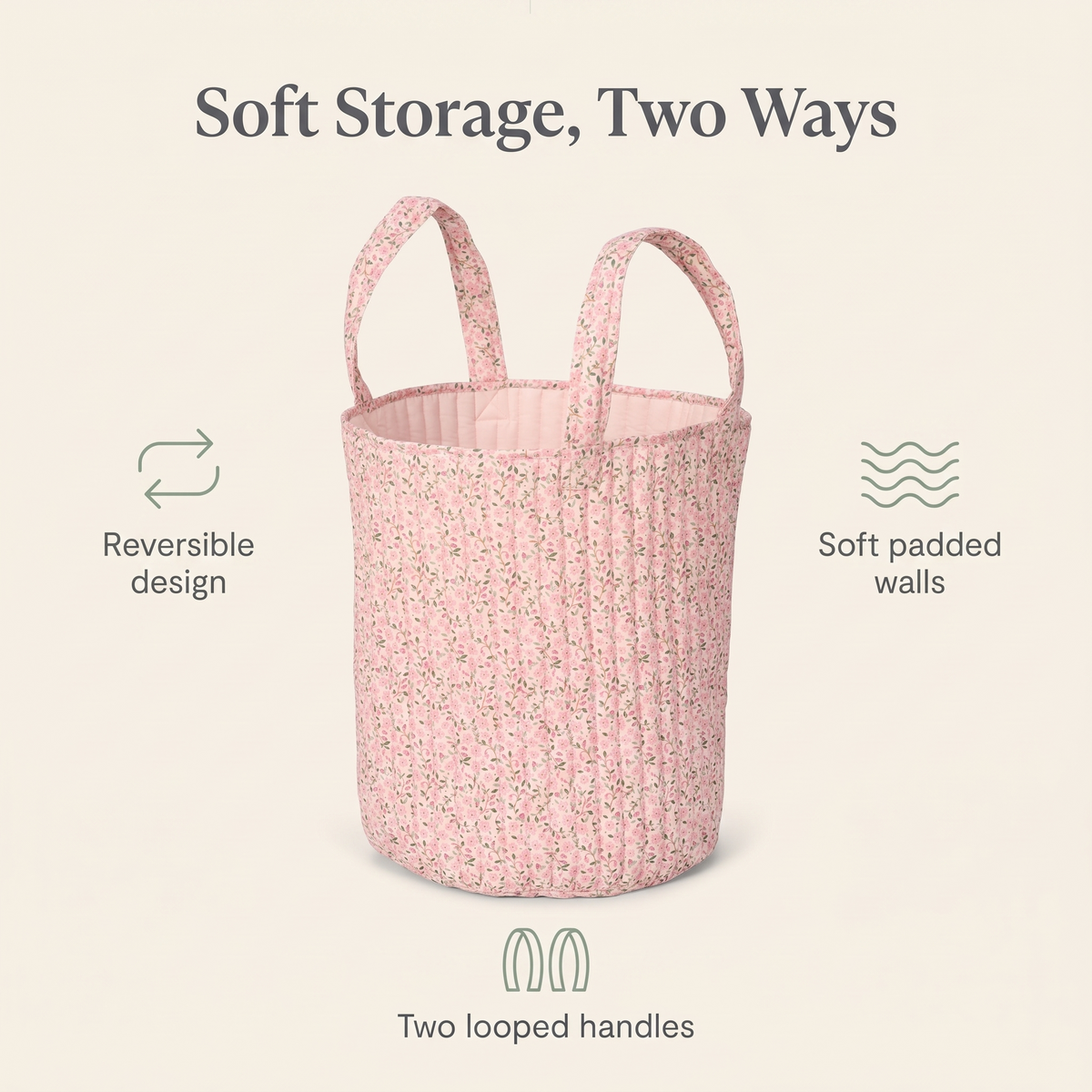 Pink storage basket holding blankets and books on a nursery floor