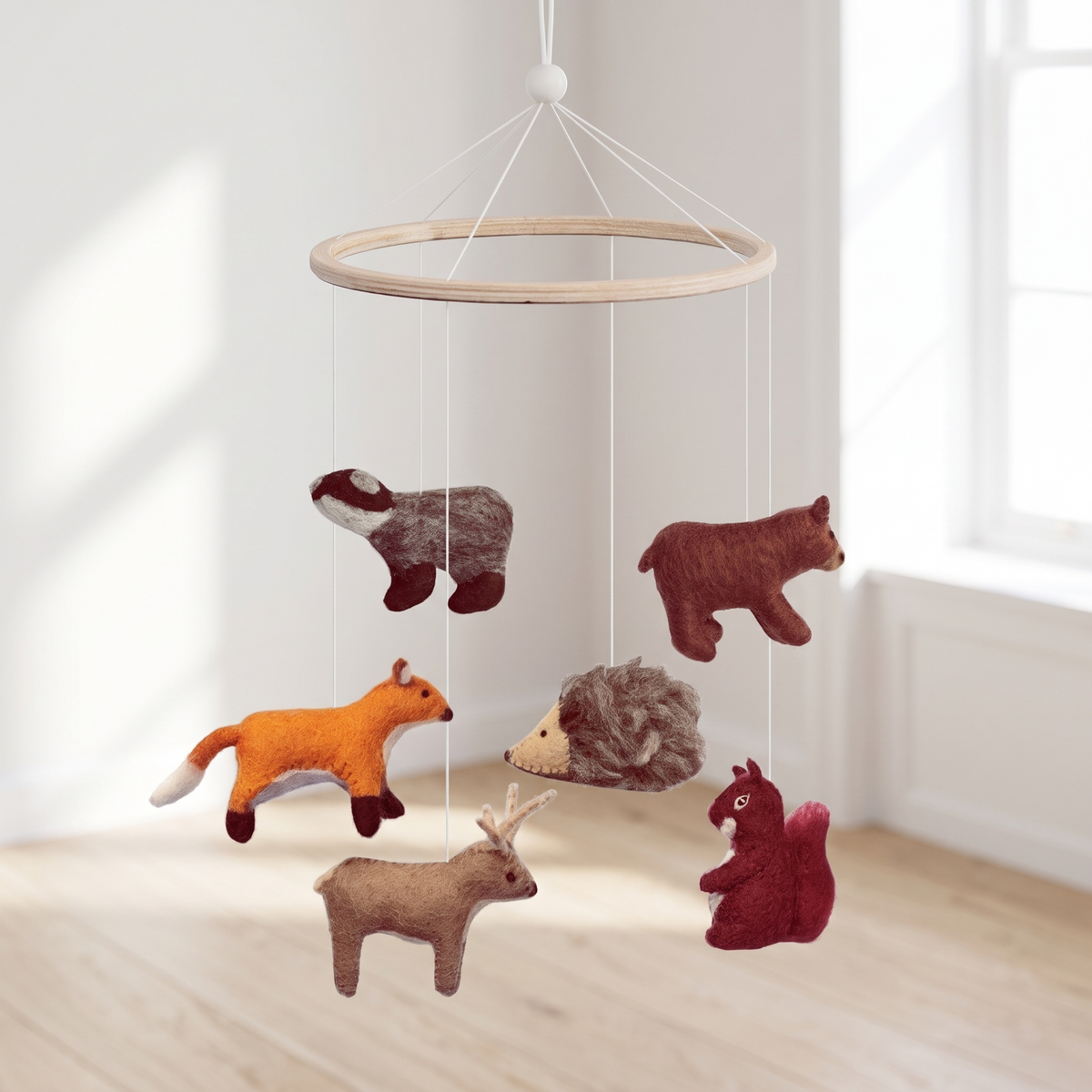 Woodland animal baby cot mobile with wool felt characters on a wooden frame