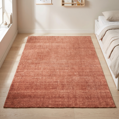 Little Teekie terracotta orange washable kids rug in a playroom