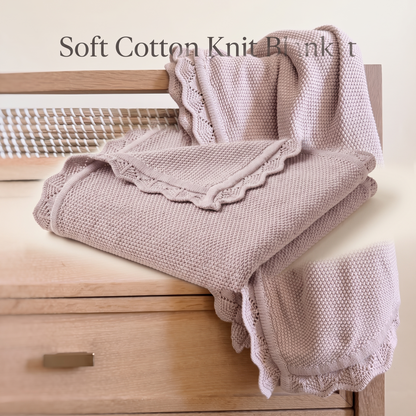 Lilac knitted baby blanket styled in a pram