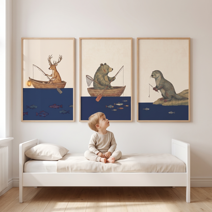 Three framed forest sailor prints hanging in a nautical kids bedroom