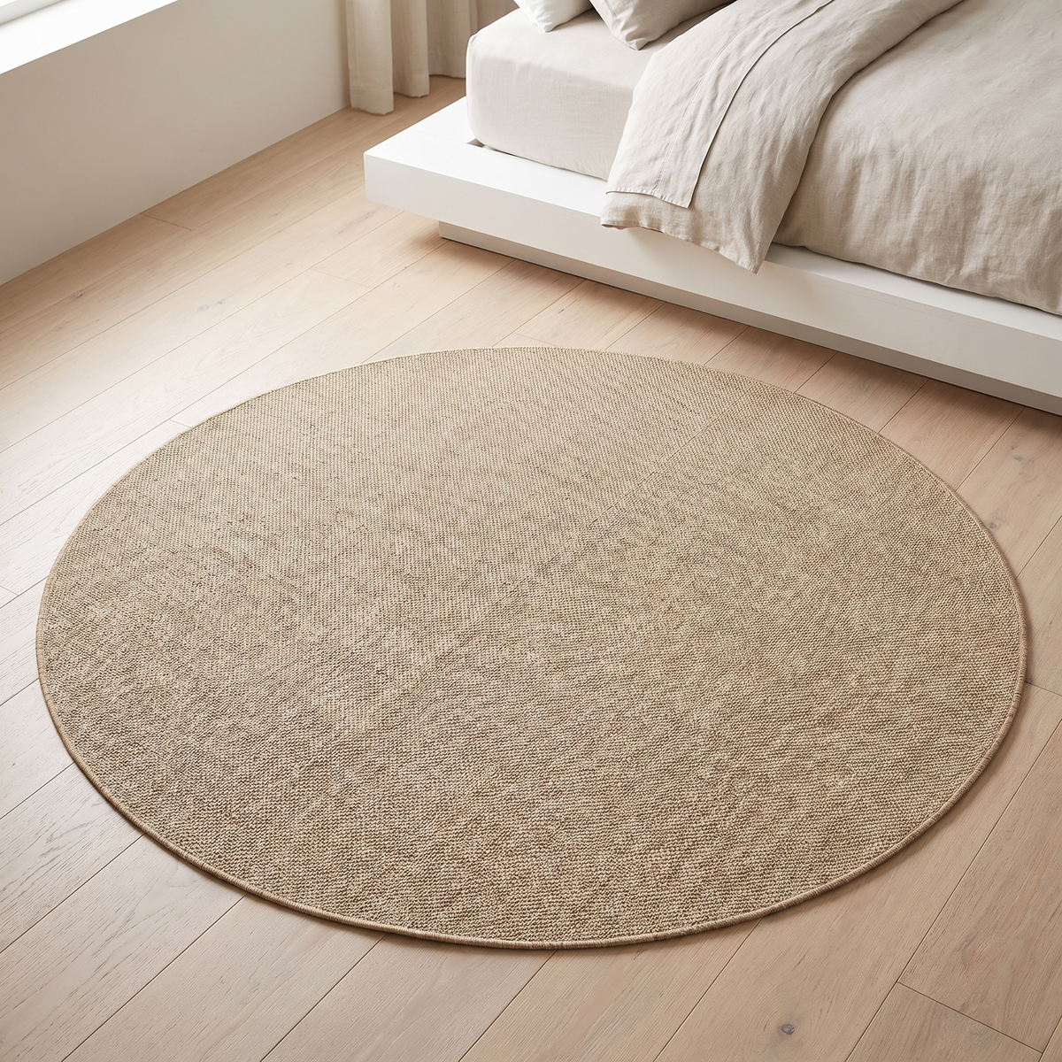 Little Teekie natural beige round woven indoor outdoor rug in a kids playroom