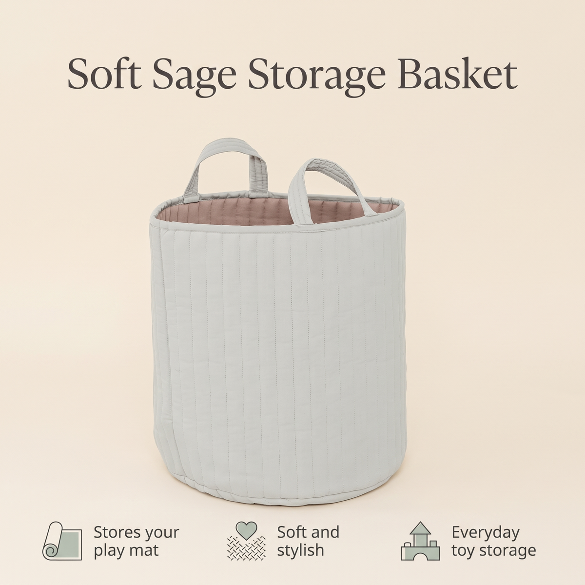 Sage green basket holding books and toys on a playroom floor
