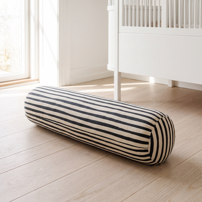Bold stripe kids support pillow on a playroom floor