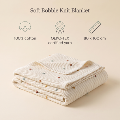 Colourful cotton bobble knit baby blanket styled on a pram
