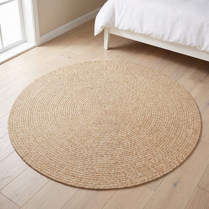 Little Teekie beige round braided flatweave rug in a kids playroom