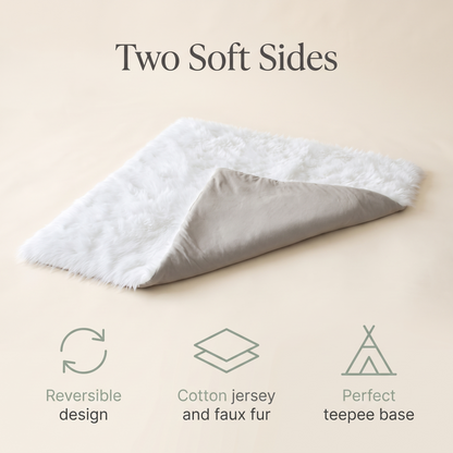 Reversible grey and white play mat styled in a soft neutral nursery